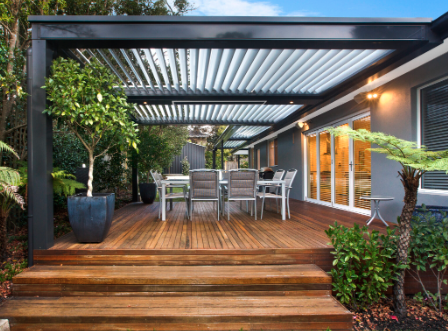 Modern deck with louvered pergola in Carytown